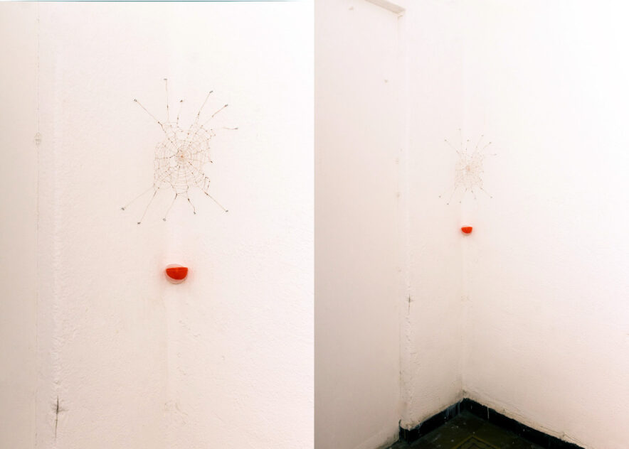 UUUUUU (The Last Laugh) by Bradly Brown — two installation views of copper-wire spiderwebs holding red clown noses on white gallery walls