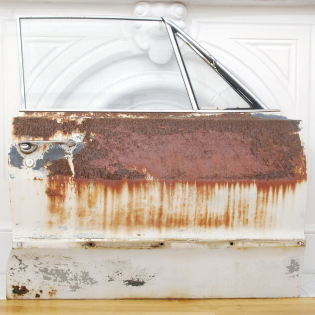 Rusted Chevy Impala car door as found, before sanding. As Impala Murder by Bradly Brown