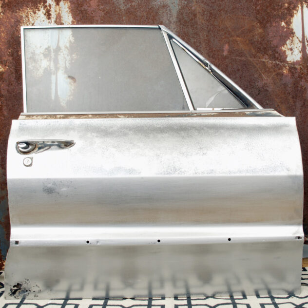 Chevy Impala car door sanded down to bare metal, before rusting. As Impala Murder by Bradly Brown